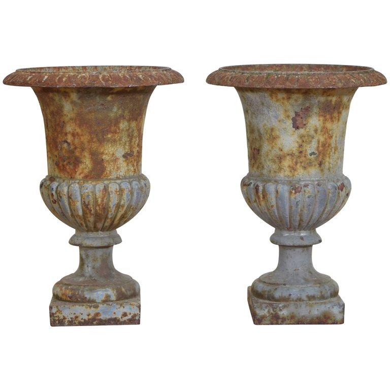 Pair Cast Iron and Parcel Painted Campana Form Urns