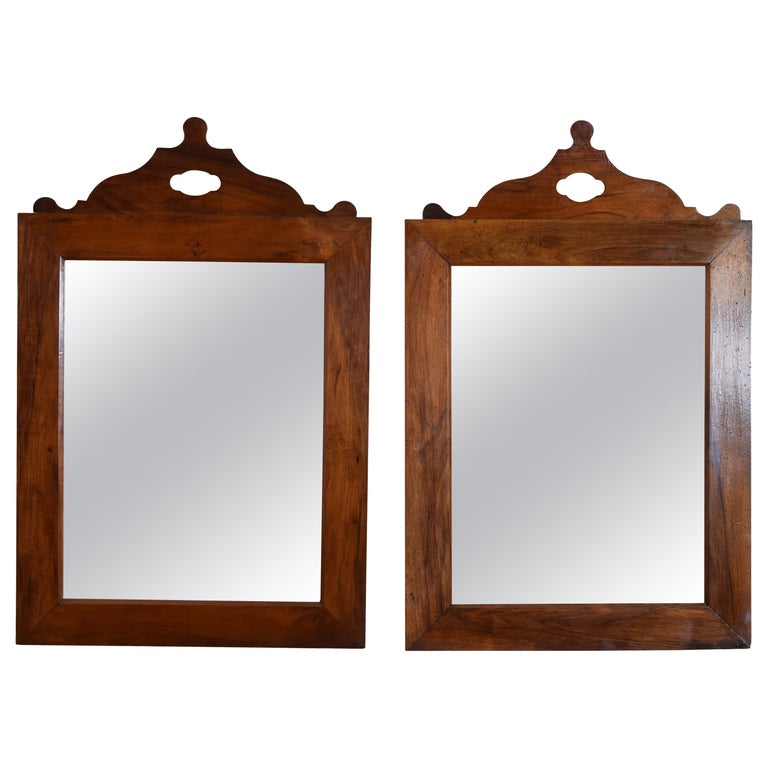 Pair of Shaped Walnut Mirrors