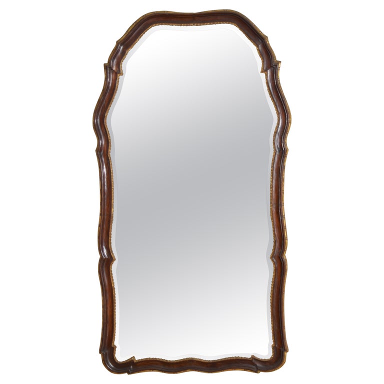 Shaped Walnut and Giltwood Mirror