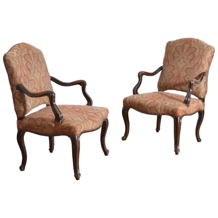 Pair of Poltrone in Carved Walnut