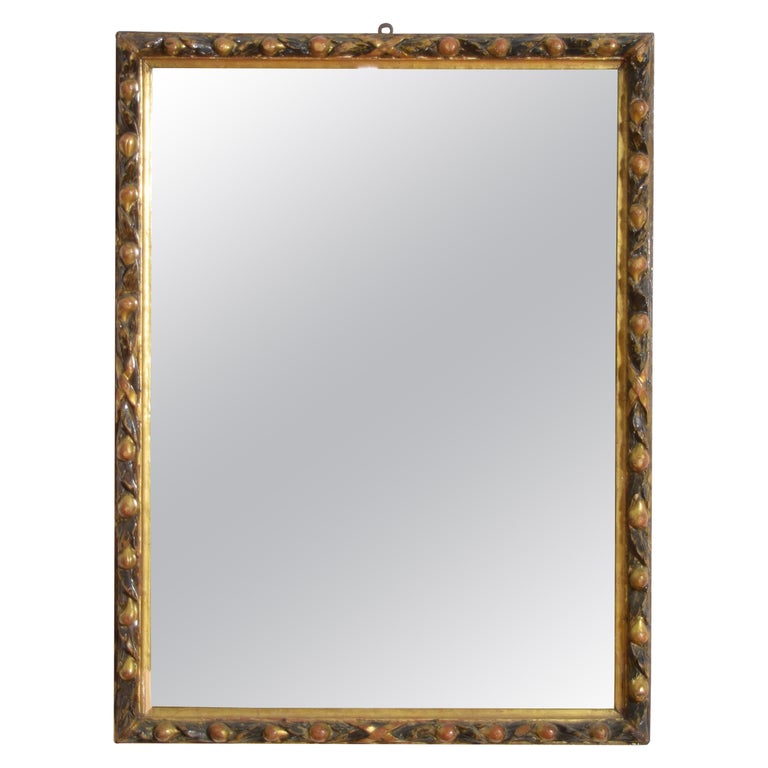 Carved Giltwood and Ebonized Mirror