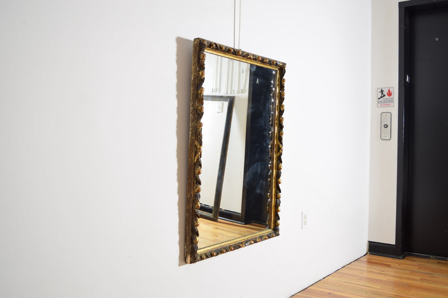 Carved Giltwood and Ebonized Mirror