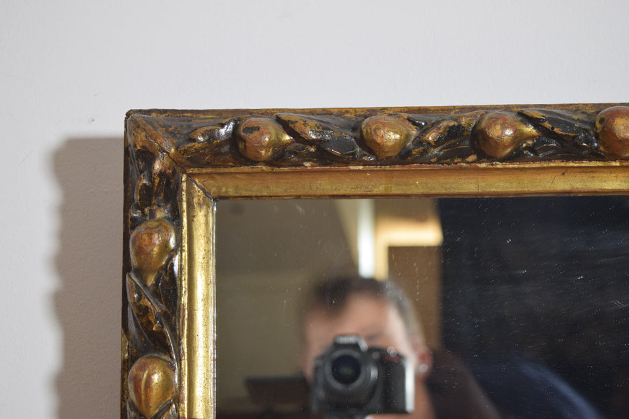 Carved Giltwood and Ebonized Mirror