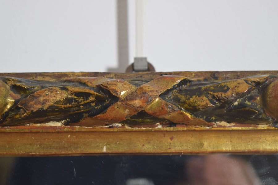 Carved Giltwood and Ebonized Mirror