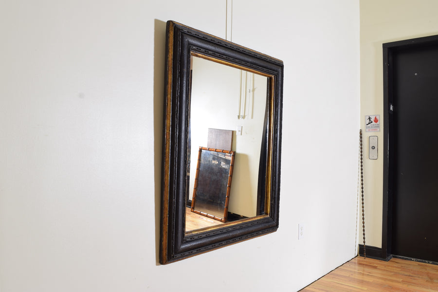 Carved, Ebonized, and Giltwood Molded Mirror