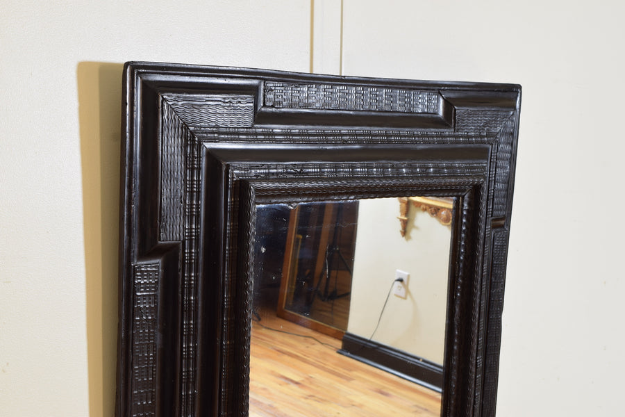 Carved and Ebonized Guilloche Mirror