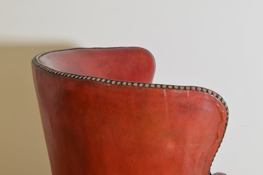 Mahogany and Leather Upholstered Swivel Wing Chair
