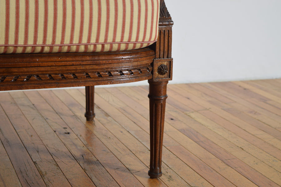 Pair of Carved Walnut and Caned Bergeres