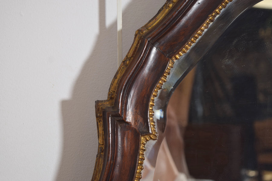 Shaped Walnut and Giltwood Mirror