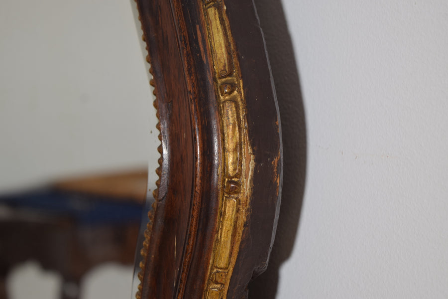 Shaped Walnut and Giltwood Mirror
