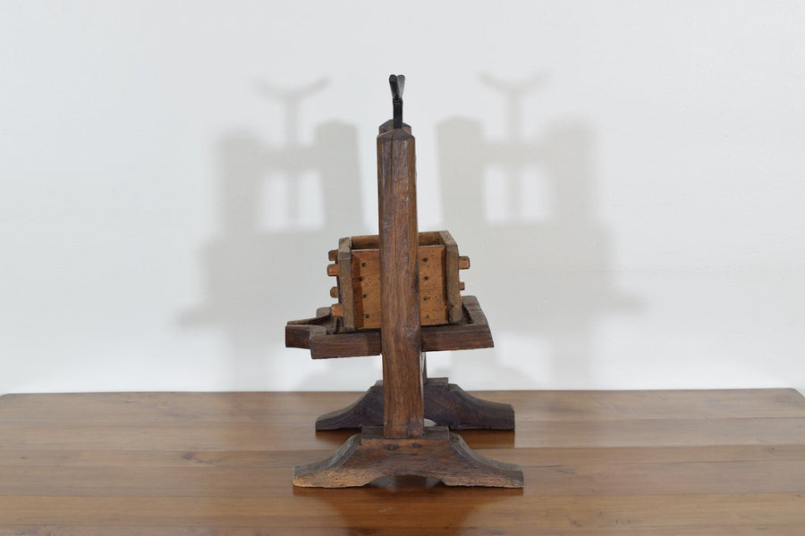 Wooden and Iron Cheese Press