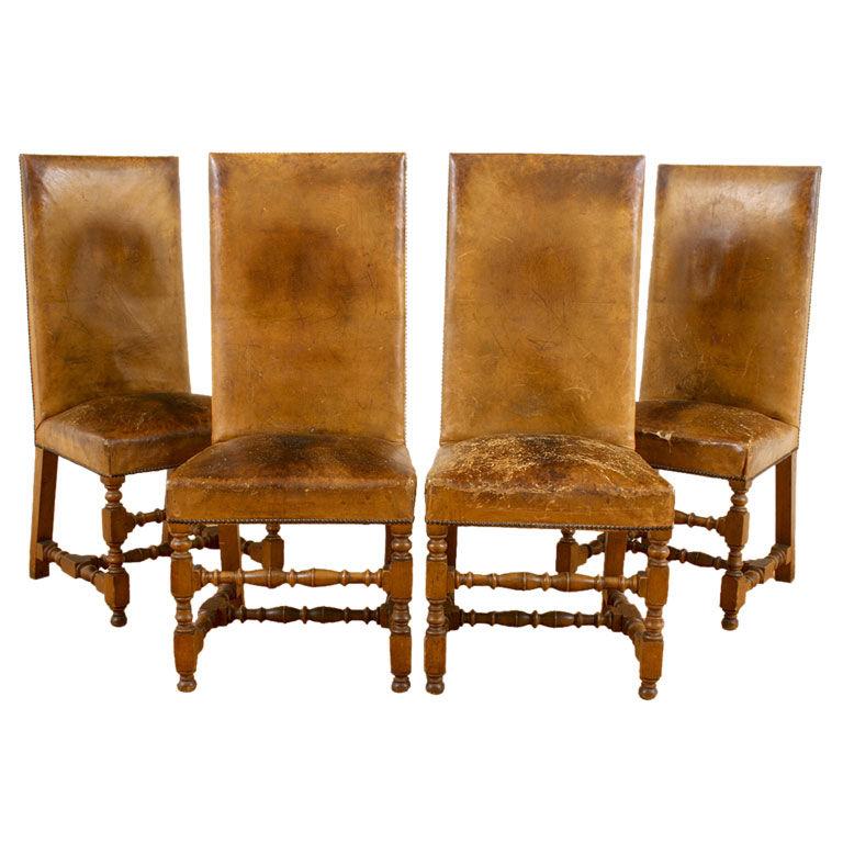 Four Walnut and Leather Upholstered Dining Chairs